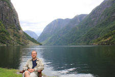 Gard on a chair in Gudvangen with a view of N�r�yfjorden