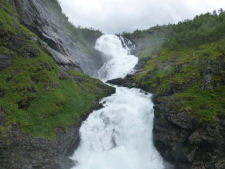 Kjosfossen waterfall can be seen on Flm railway