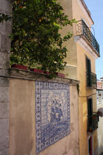 Back alley in Lisbon with tiles and a lemon tree